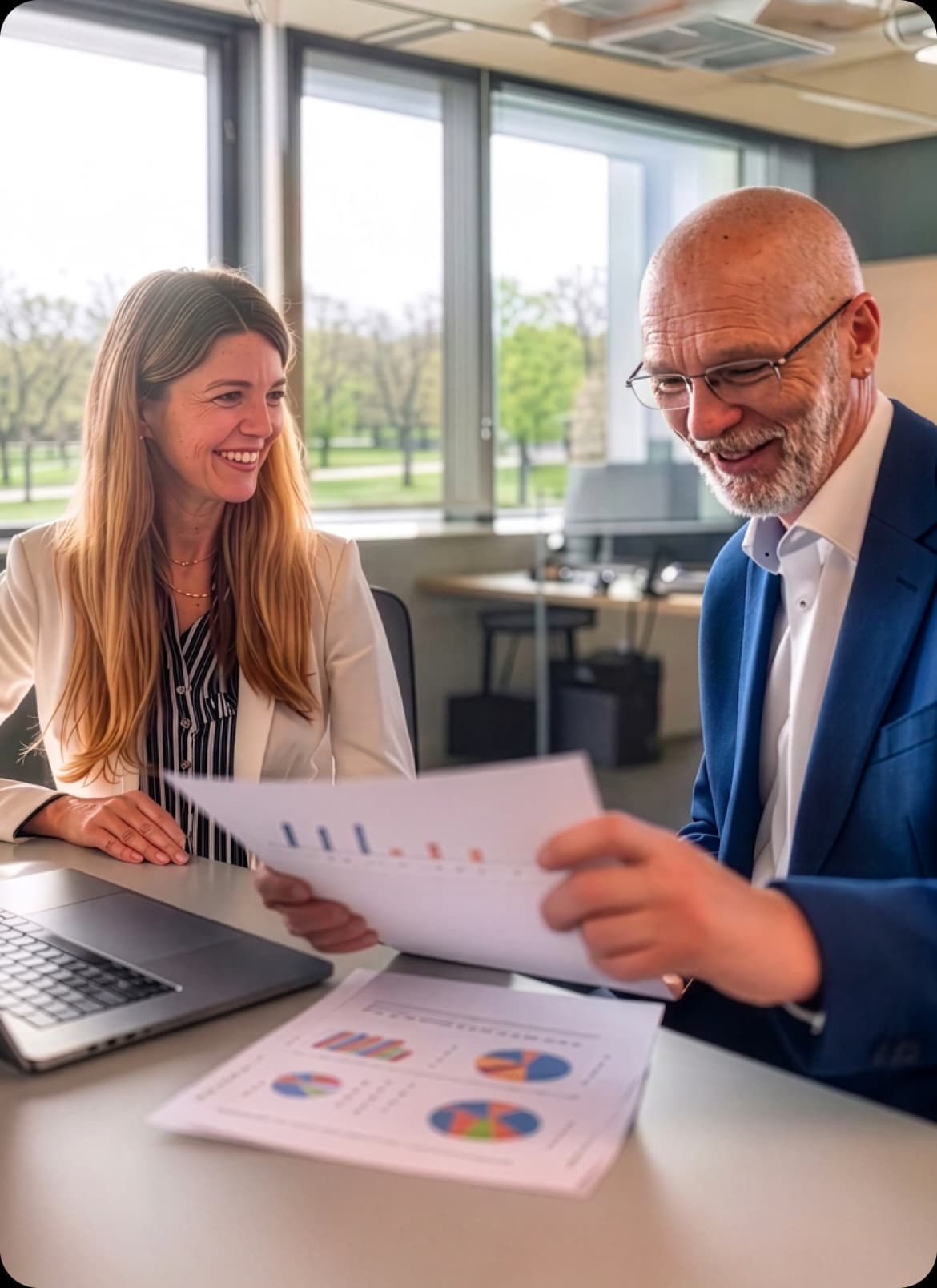 Accountant reviewing a software spend report with a client